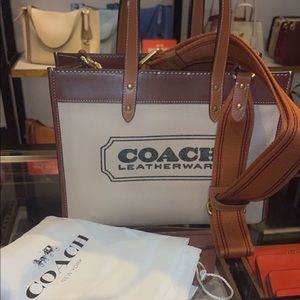 Coach bag. New as can be. Brown Med orange .